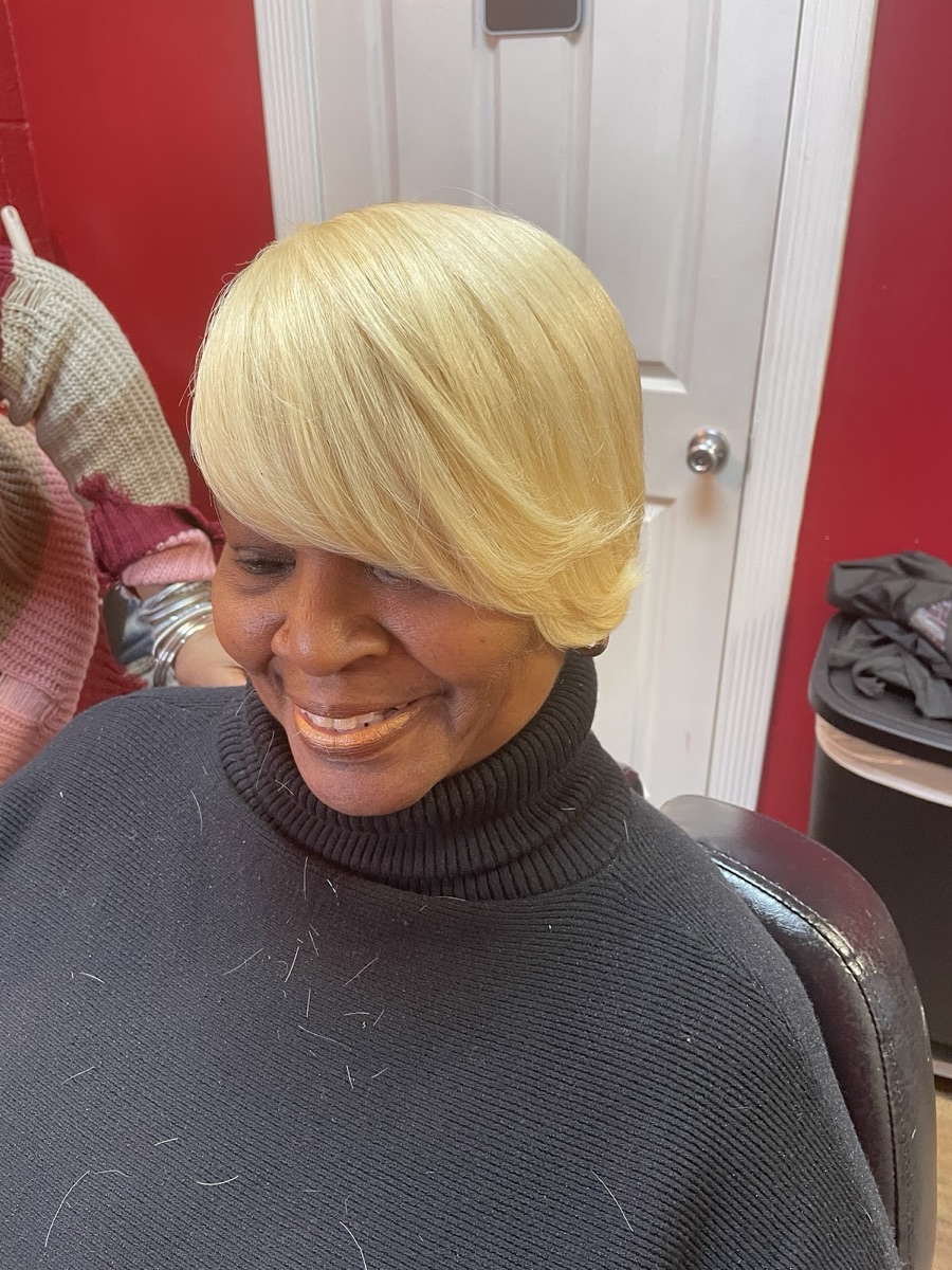 Fresh styled cut, smiling client in the barber chair